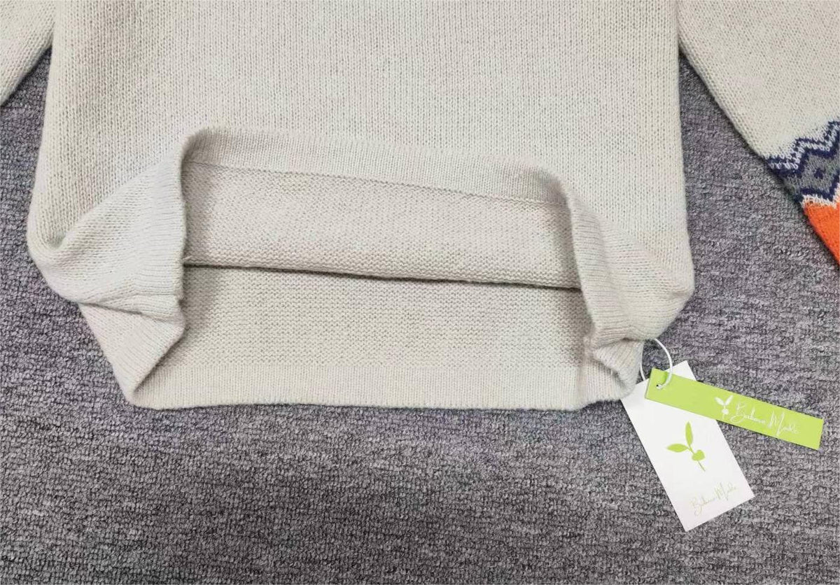 NordicChic 舒适毛衣 — 宽松版型，活泼领口图案