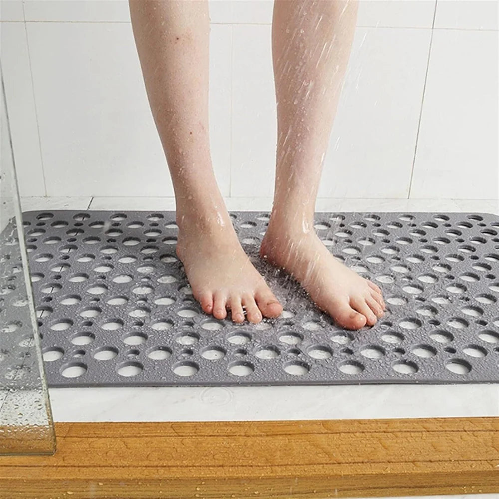 Flexibele badmat van pvc — achterkant met zuignappen en geperforeerde afvoergaten