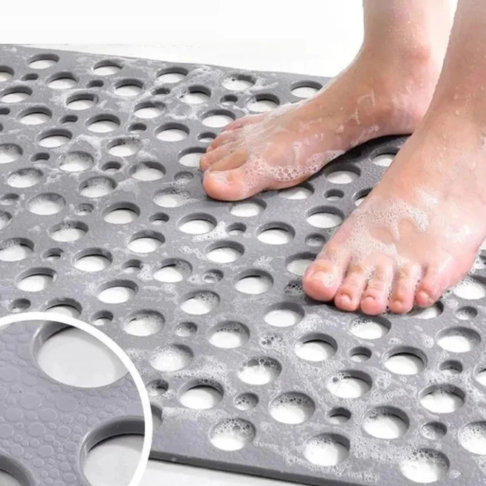 Flexibele badmat van pvc — achterkant met zuignappen en geperforeerde afvoergaten