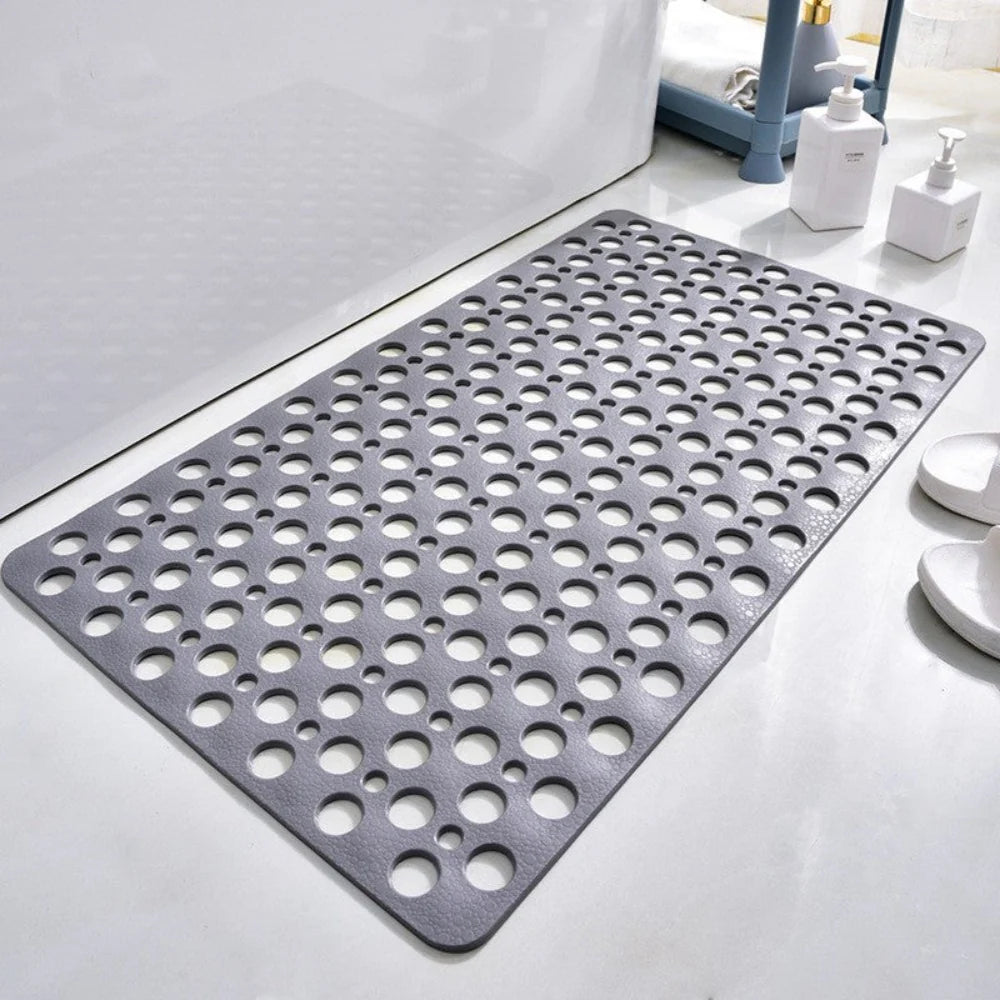 Flexibele badmat van pvc — achterkant met zuignappen en geperforeerde afvoergaten