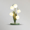 Bell-Orchideen-Tischlampe — floraler Tulpenschirm, Sockel aus Metall und Polycarbonat