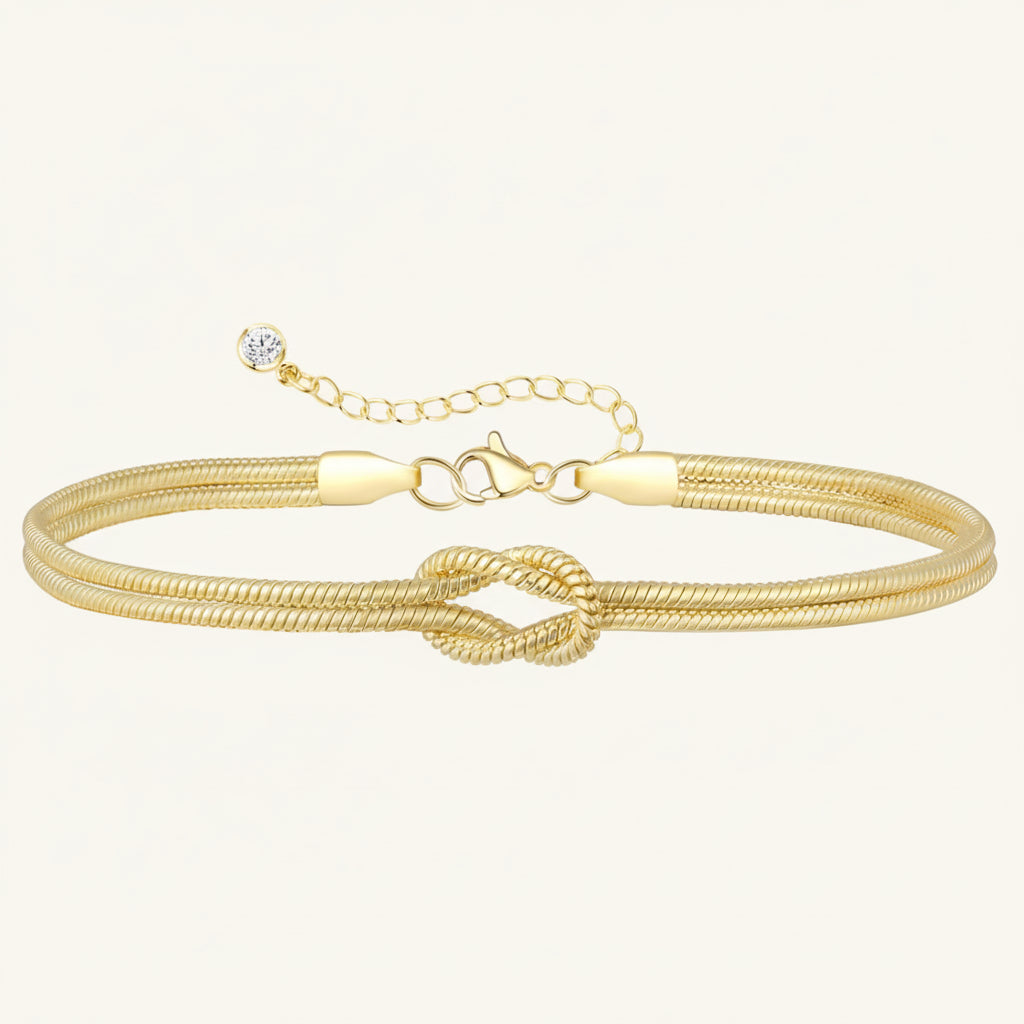 Justerbart armband med flera kedjor — central tvinnad knut