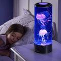 مصباح طاولة LED على شكل قنديل بحر — عرض ألوان، أسطوانة شفافة، ارتفاع 26cm وقطر 9cm