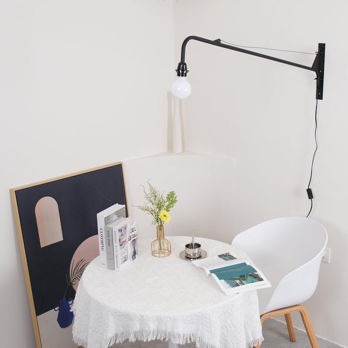Minimalistické černé kovové nastavitelné LED nástěnné svítidlo pro moderní interiéry
