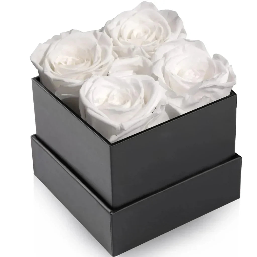 Elegant blomsterarrangemang med rosor – dekorativ visningsask