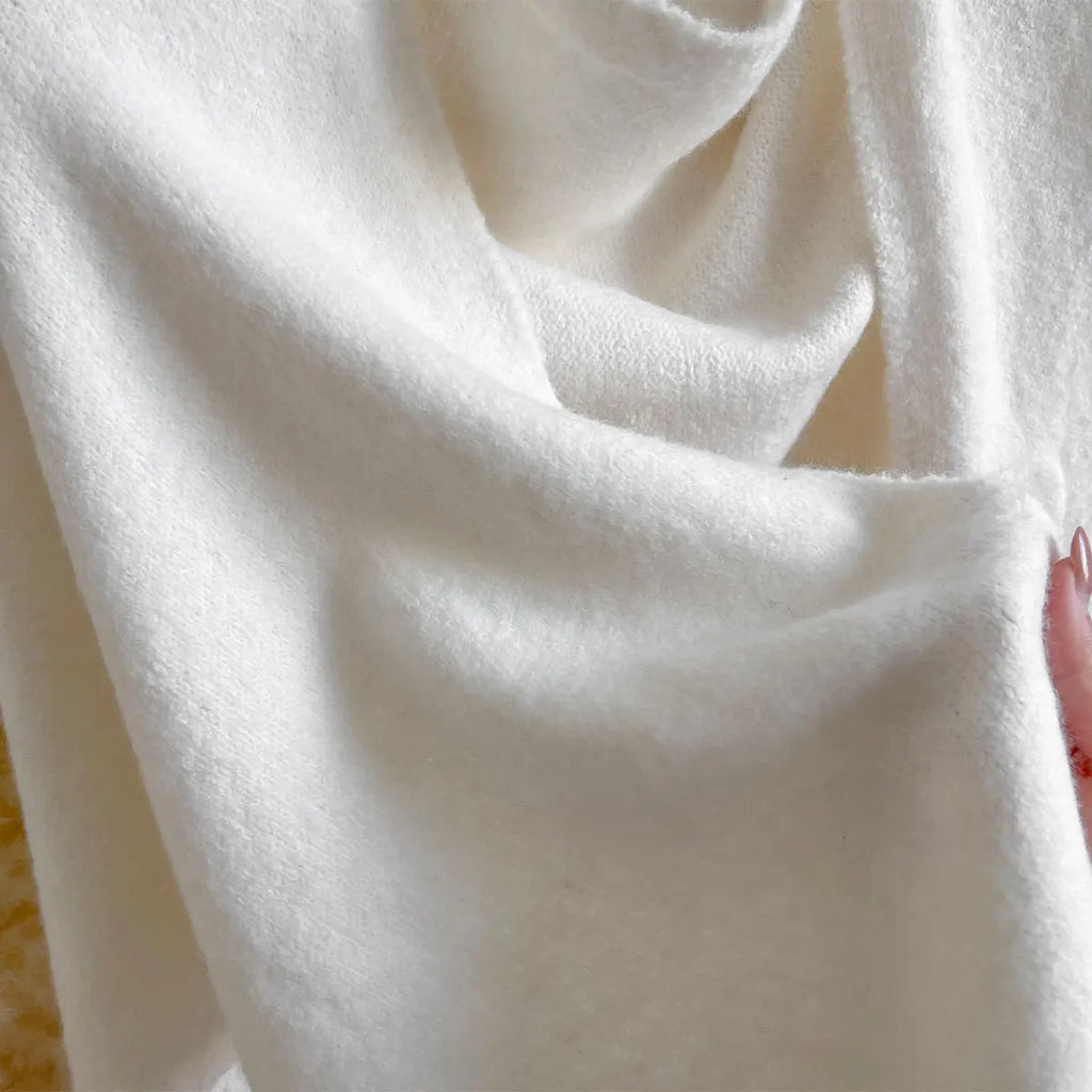 The Fleece Shawl With Elegant Draping And Lightweight Warmth