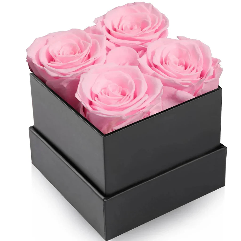 Elegant blomsterarrangemang med rosor – dekorativ visningsask
