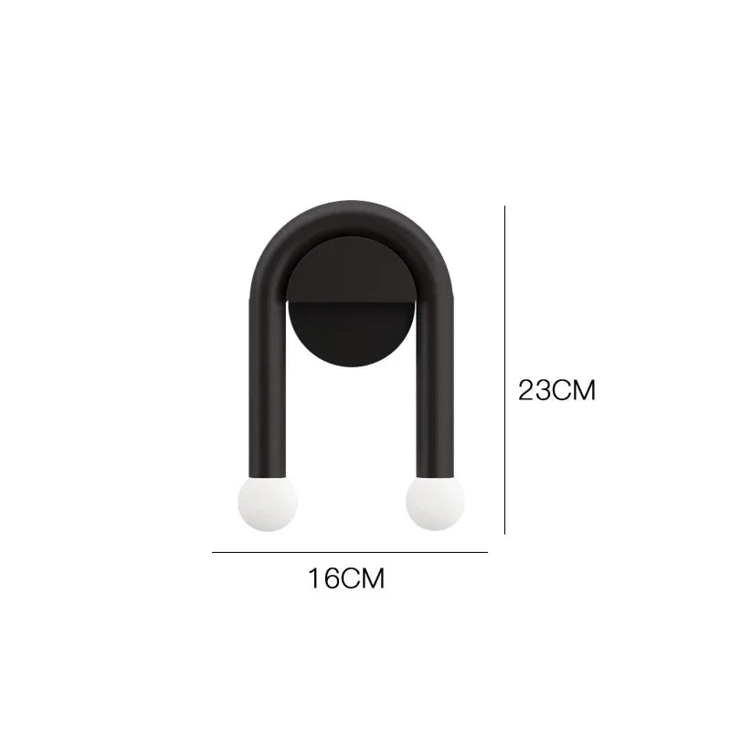 Nowoczesna lampa ścienna Arcus — nordycki minimalistyczny design, matowe czarne żelazo i mleczne szkło LED