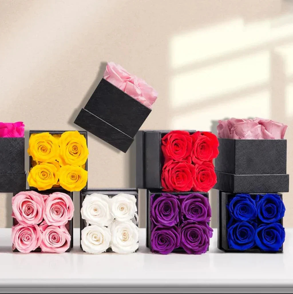 Elegant blomsterarrangemang med rosor – dekorativ visningsask