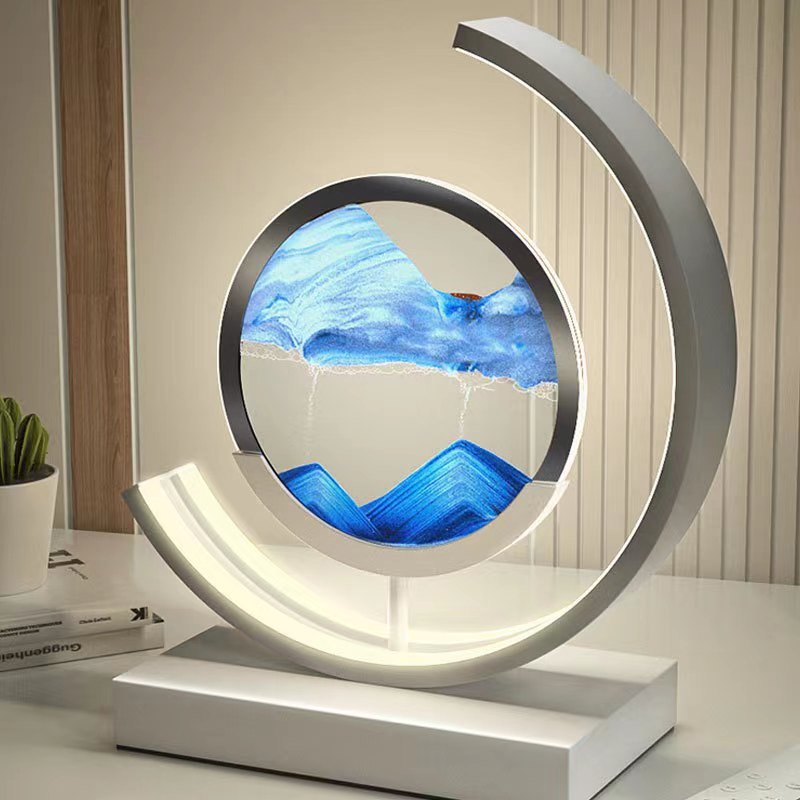 Stolní LED lampa Sandlight Quicksand — animovaná písková socha