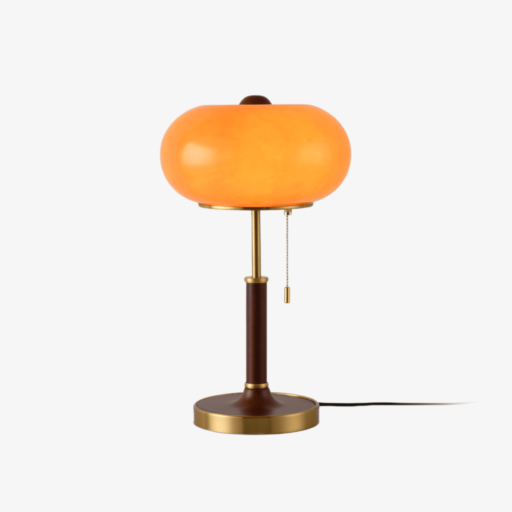 Lampada da comodino con lanterna in vetro ambra e paralume con finitura dorata